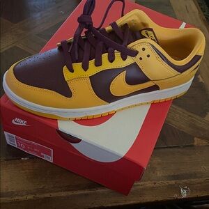 Nike Dunk Low Retro
Nike Men's Brown and Yellow Sneakers
